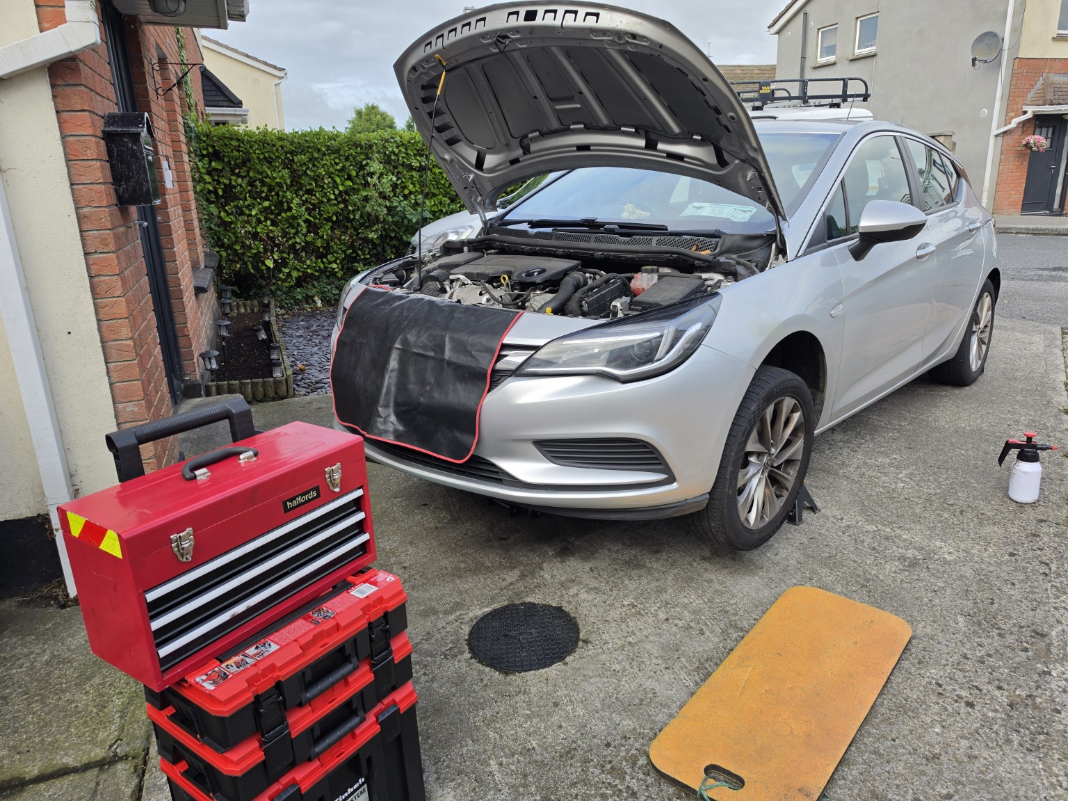 A&Q mobile mechanic servicing a customer's car at home